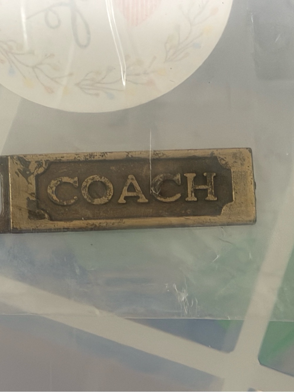 Coach Brass Tone Rectangular Logo zipper pull